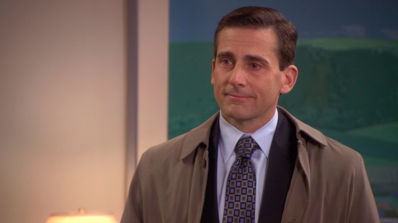 Michael Scott (Steve Carell) stands with tears in his eyes in The Office