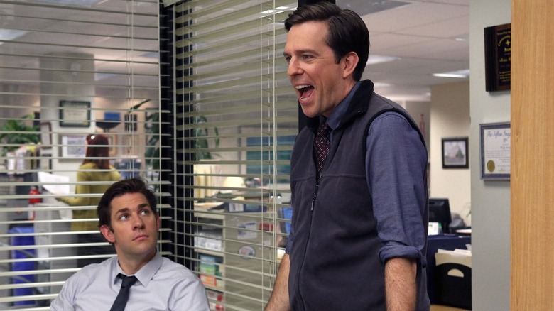 John Krasinski as Jim Halpert looks at Ed Helms as Andy Bernard in The Office