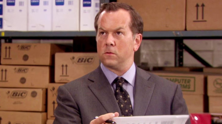 David Costabile as Eric Ward looks concerned in The Office
