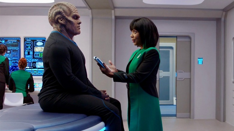 Bortus and Dr. Finn talking in The Orville medical facility
