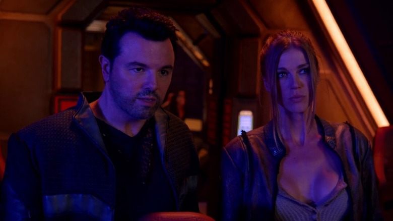 Ed and Kelly bathed in purple light while gazing out a spaceship window on The Orville S2E14