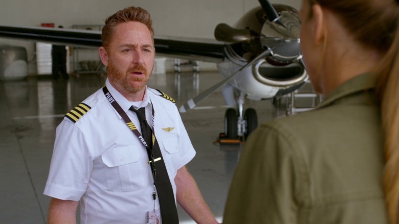 Gordon staring at Kelly and Ed in his 2025 pilot uniform on The Orville S3E6