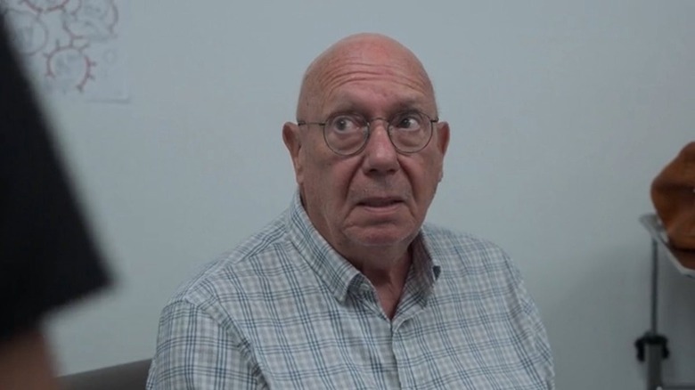 Mr. Cohen (Dann Florek) sitting down on "The Pitt."