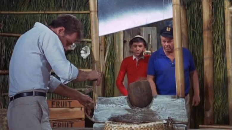 Gilligan and Skipper watch The Professor with his guillotine