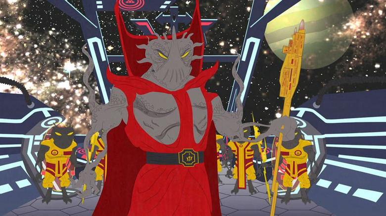 Alien conqueror Xenu wears a red robe while standing aboard a spaceship with his alien henchmen stand behind him in "South Park"