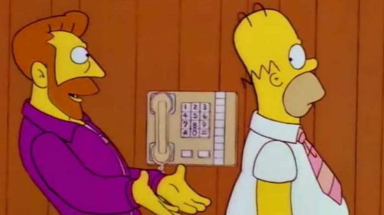 Gene Scorpio holds his hands out to catch Homer Simpson on The Simpsons
