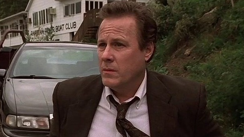 John Heard as Vin Makazian, standing near his car in The Sopranos.