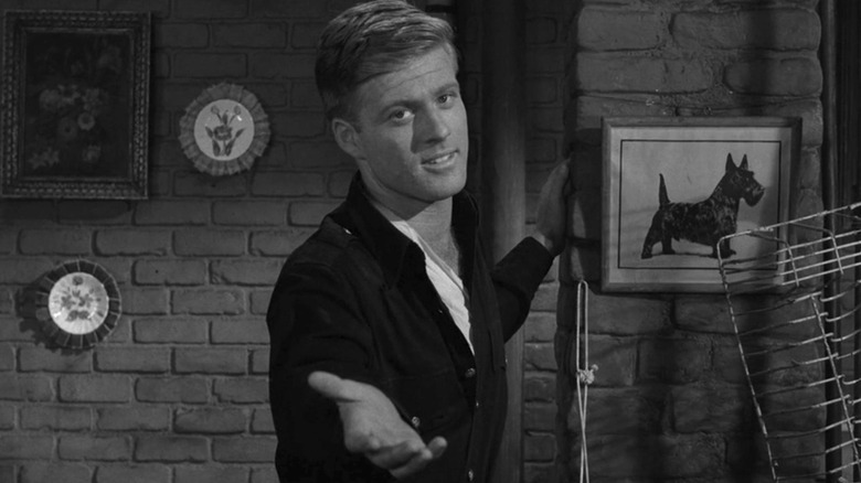 Harold Beldon (Robert Redford) offers his hand to the camera in The Twilight Zone