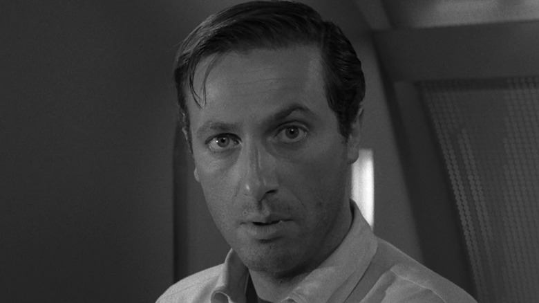 Michael Chambers (Lloyd Bochner) is skeptical in The Twilight Zone, To Serve Man