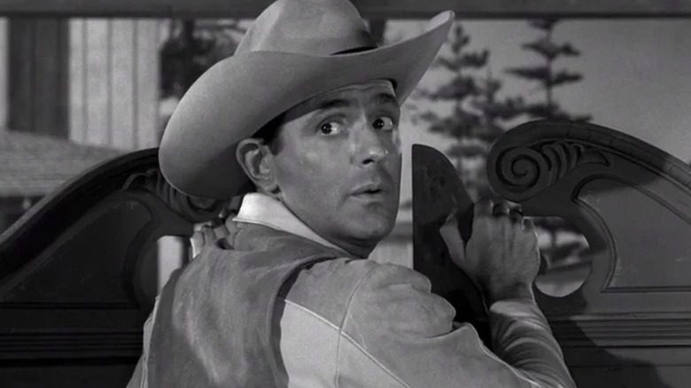 Rance McGrew looking behind him in cowboy clothes on The Twilight Zone