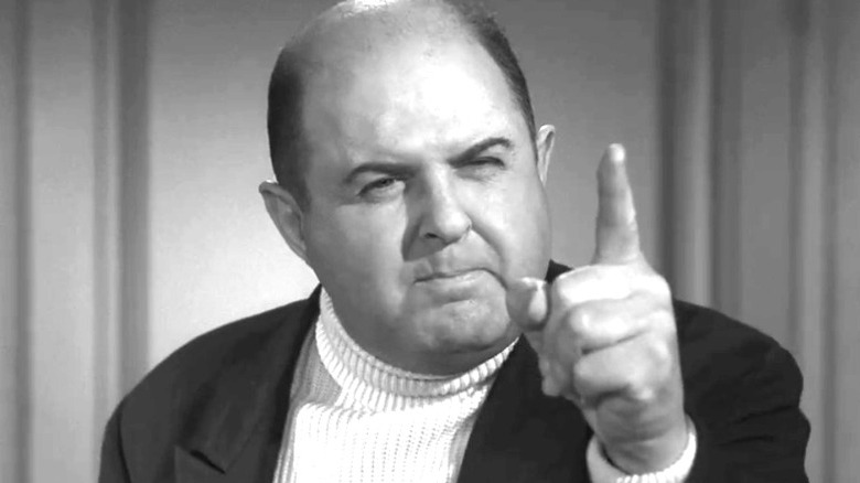 Roswell G. Flemington raising a finger and looking angry on The Twilight Zone