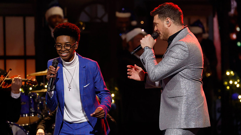 Max Chambers and Michael Bublé perform on the live Season 28 finale of The Voice