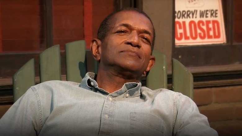 Lenny Caulfield leaning back in a chair in "General Hospital"