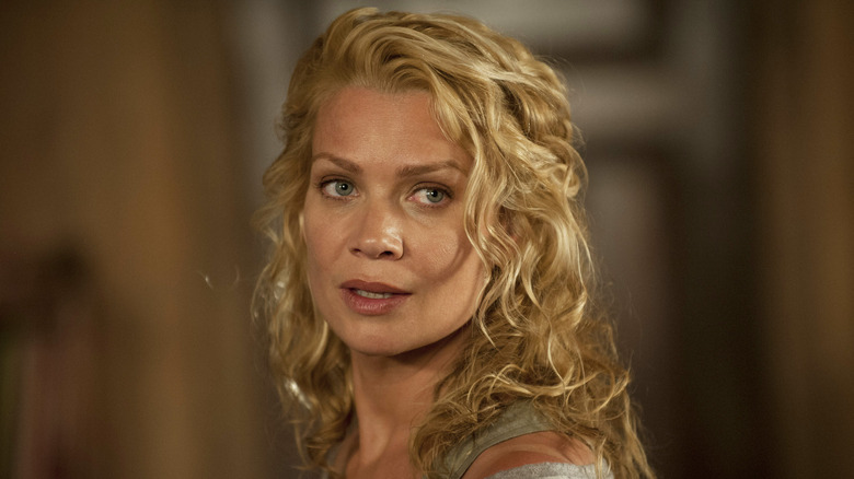 Laurie Holden as Andrea Harrison, looking over her shoulder in The Walking Dead.