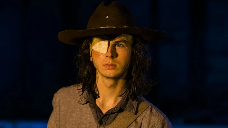 Chandler Riggs as Carl Grimes, with a patch over his eye in The Walking Dead.