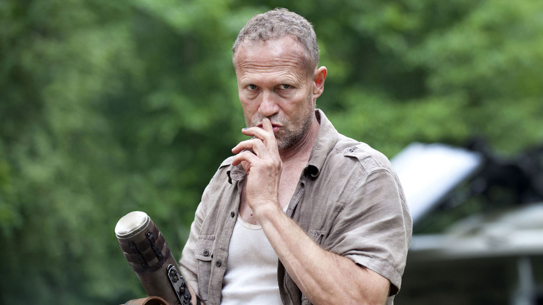 Michael Rooker as Merle Dixon, shushing in The Walking Dead.