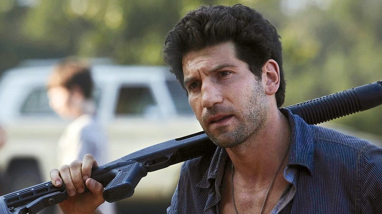 Jon Bernthal as Shane Walsh, holding a shotgun in The Walking Dead.