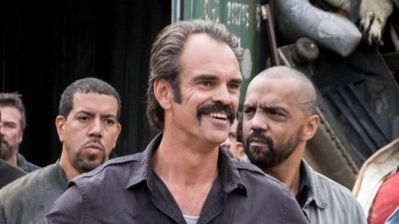 Steven Ogg as Simon, smiling in The Walking Dead.