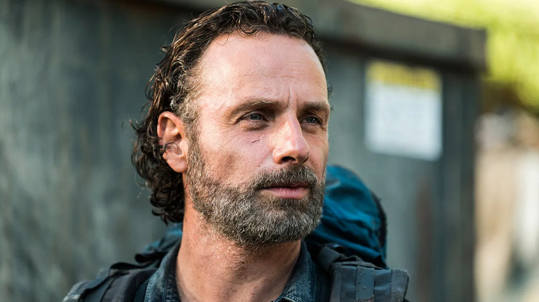 Andrew Lincoln as Rick Grimes looks happy in The Walking Dead