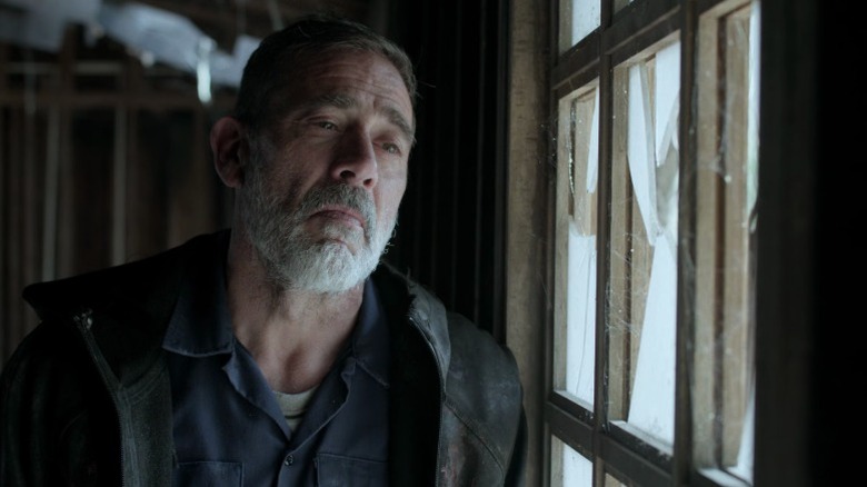 Negan standing by a window on The Walking Dead S11E3