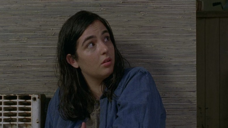 Tara sitting on the floor and looking to her left on The Walking Dead S7E6