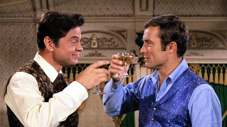 James T. West and Artemus Gordon have a drink in "The Wild Wild West" (1965)