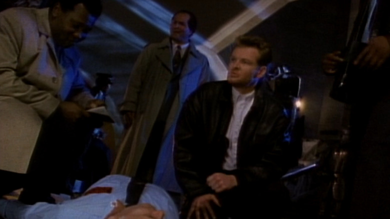 Nick Knight investigates a dead body in Forever Knight (1992)