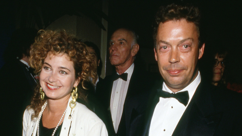Tim Curry and Annie Potts in formal wear at an event