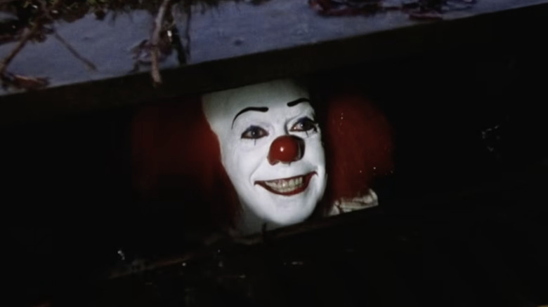 Pennywise smiling in a sewer