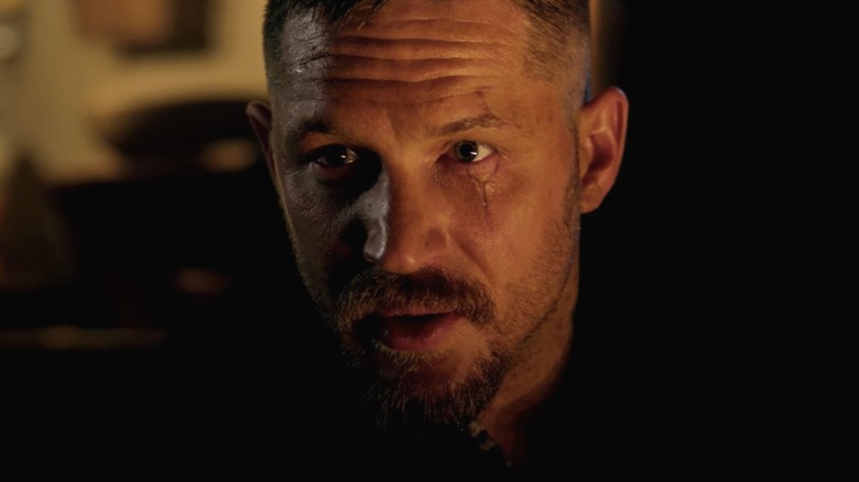 James Delaney speaks to someone offscreen in Taboo