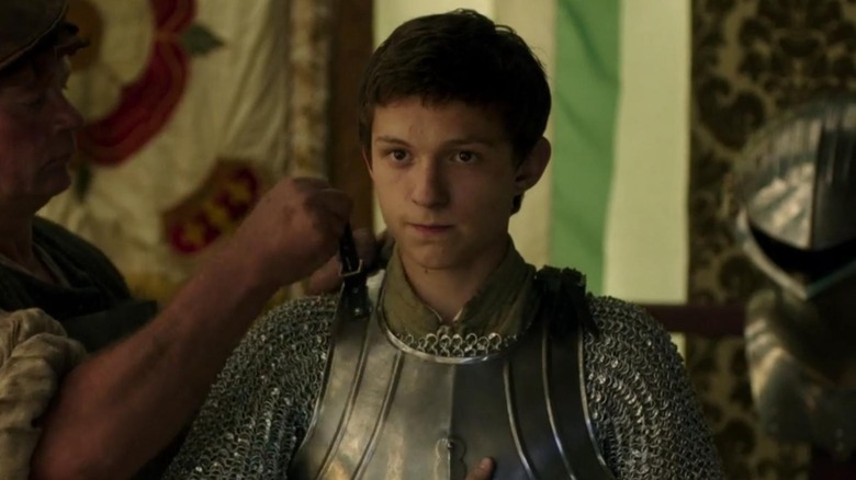 Tom Holland getting armor fitted as Gregory Cromwell in "Wolf Hall" (2015)