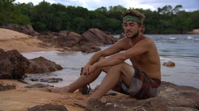 J.T. sitting on the beach talking to the camera on Survivor: Heroes vs. Villains
