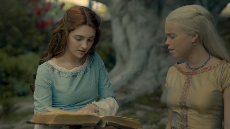 Young Alicent, played by Emily Carey, and Rhaenyra, played by Milly Alcock, as friends, years before they go to war against each other in The House of the Dragon