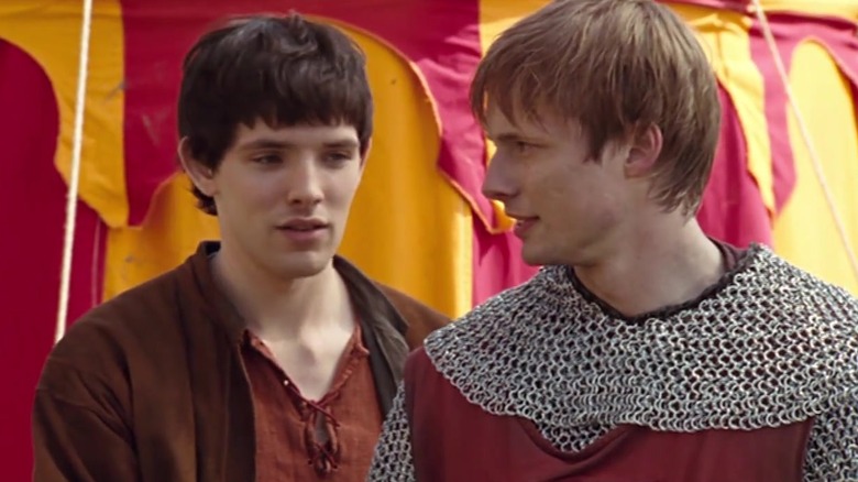 Colin Morgan's Merlin helps Bradley James' Prince Arthur celebrate a victory.