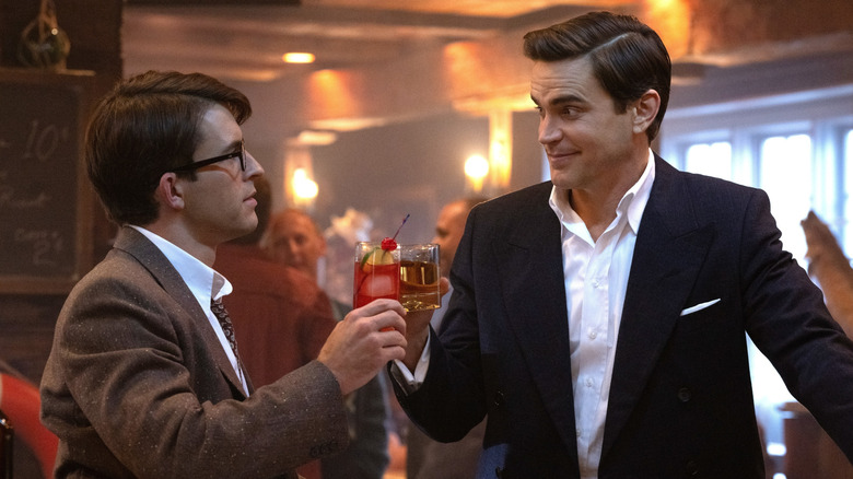 Tim and Hawk raise glasses