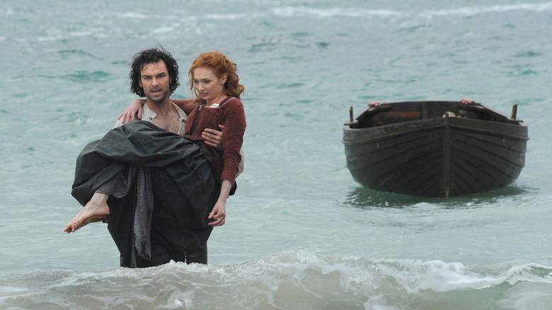 Poldark carrying Demelza through water