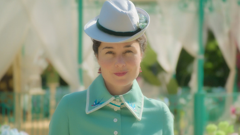 Elena smirking at camera