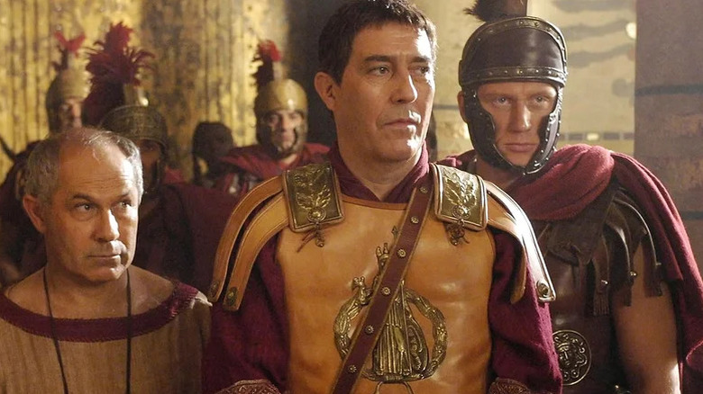 Nicholas Woodeson as Posca standing next to Ciarán Hinds as Julius Caeser and Kevin McKidd as Lucius in ancient Roman attire in Rome