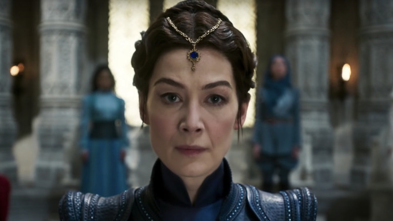 Rosamund Pike  with blue jewelry on forehead as Moiraine in Wheel of Time