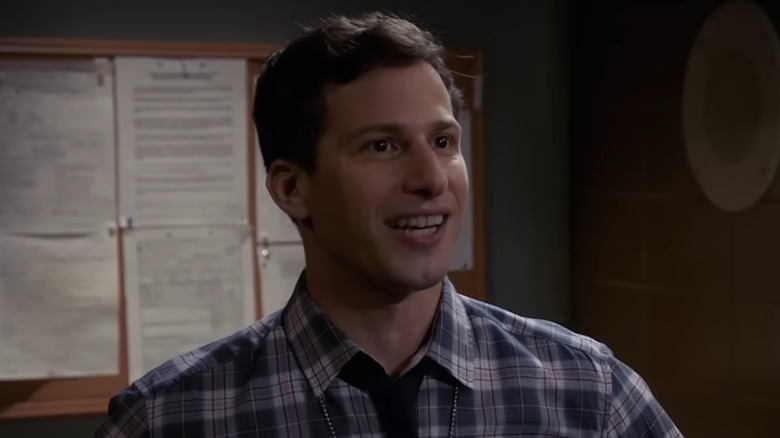 Detective Jake Peralta smiling at someone