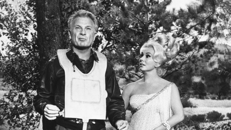 Green Acres husland and wife Eddie Albert and Eva Gabor show off their glam garb in their new country home