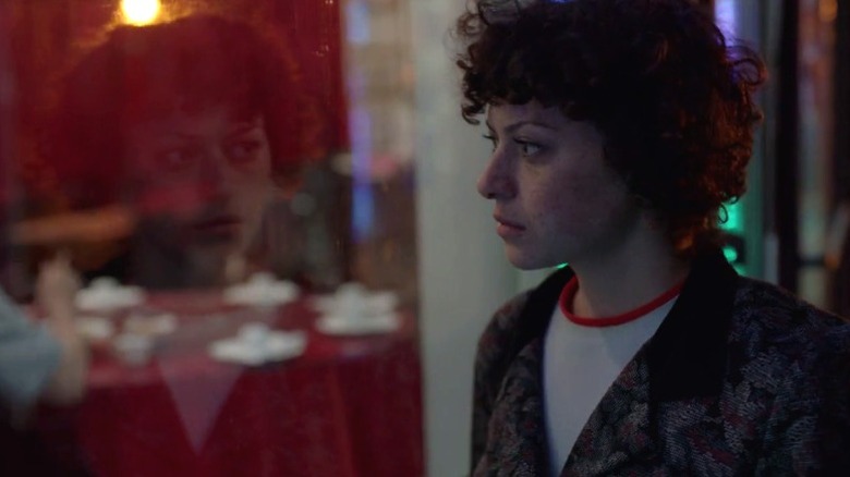 Dory Sief looking through a restaurant window on Search Party S1E1