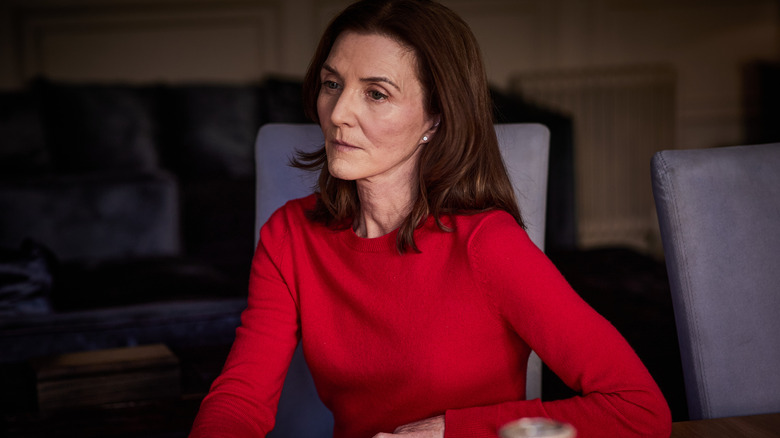 Michelle Fairley as Marian Wallace wearing a red top in Gangs of London
