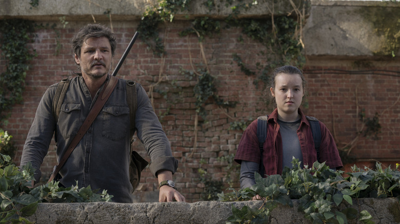 Joel and Ellie stand together in an outdoor space in "The Last of Us" (2023)