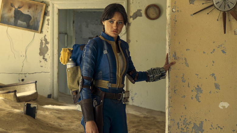 Ella Purnell as Lucy in blue suit in Fallout