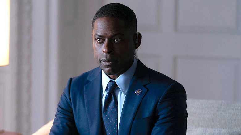 Sterling K. Brown as Xavier wearing blue suit in Paradise