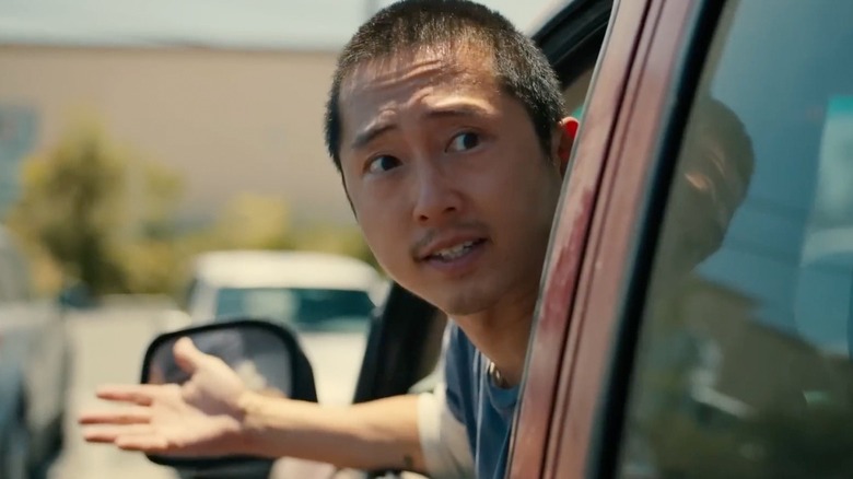 Danny Cho (Steven Yeun) is upset in his car in Beef