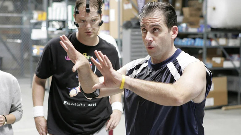 Dwight Schrute (Rainn Wilson) and Michael Scott (Steve Carell) wear athletic clothes in the warehouse in The Office (2005)