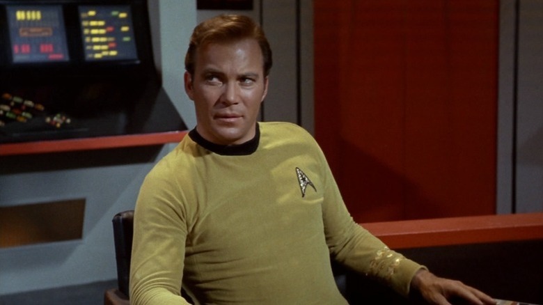 Captain Kirk sitting in a chair on "Star Trek: The Original Series"