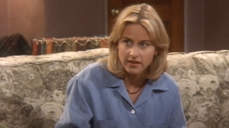 Ellen Morgan (Ellen DeGeneres) sits on her couch in Ellen